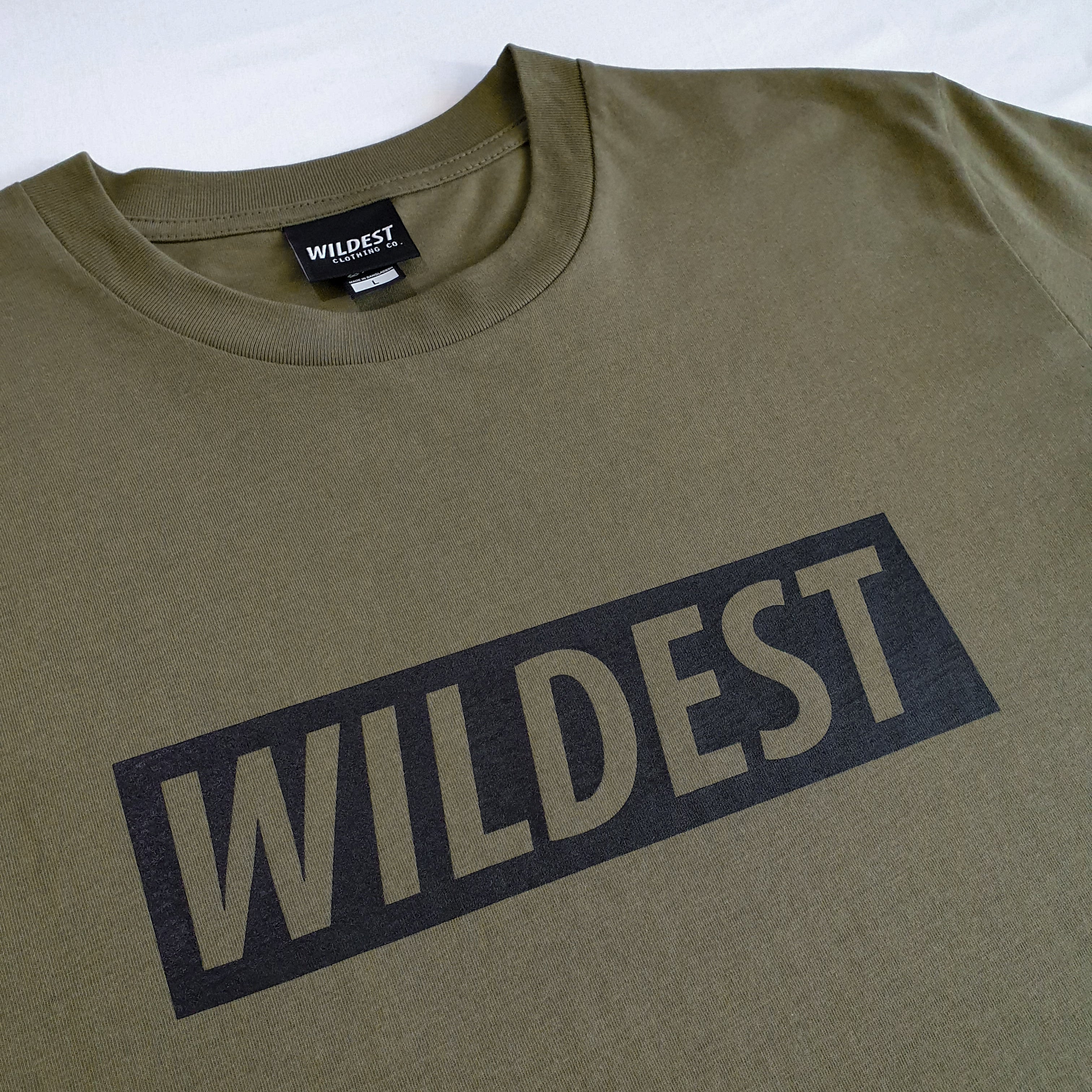 Close up of army green long sleeve t shirt with black Wildest block print