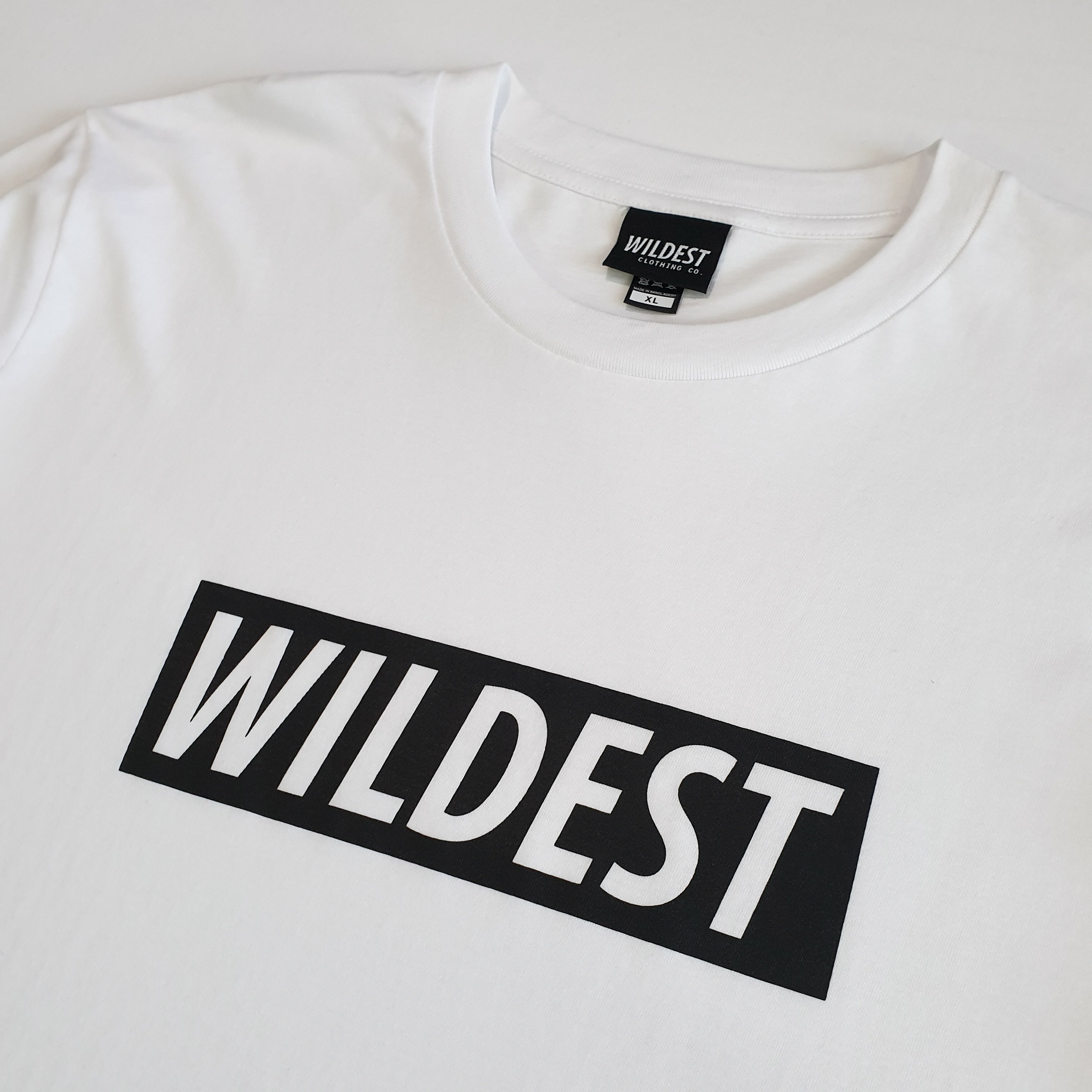 Close up of white long sleeve t shirt with black Wildest block print