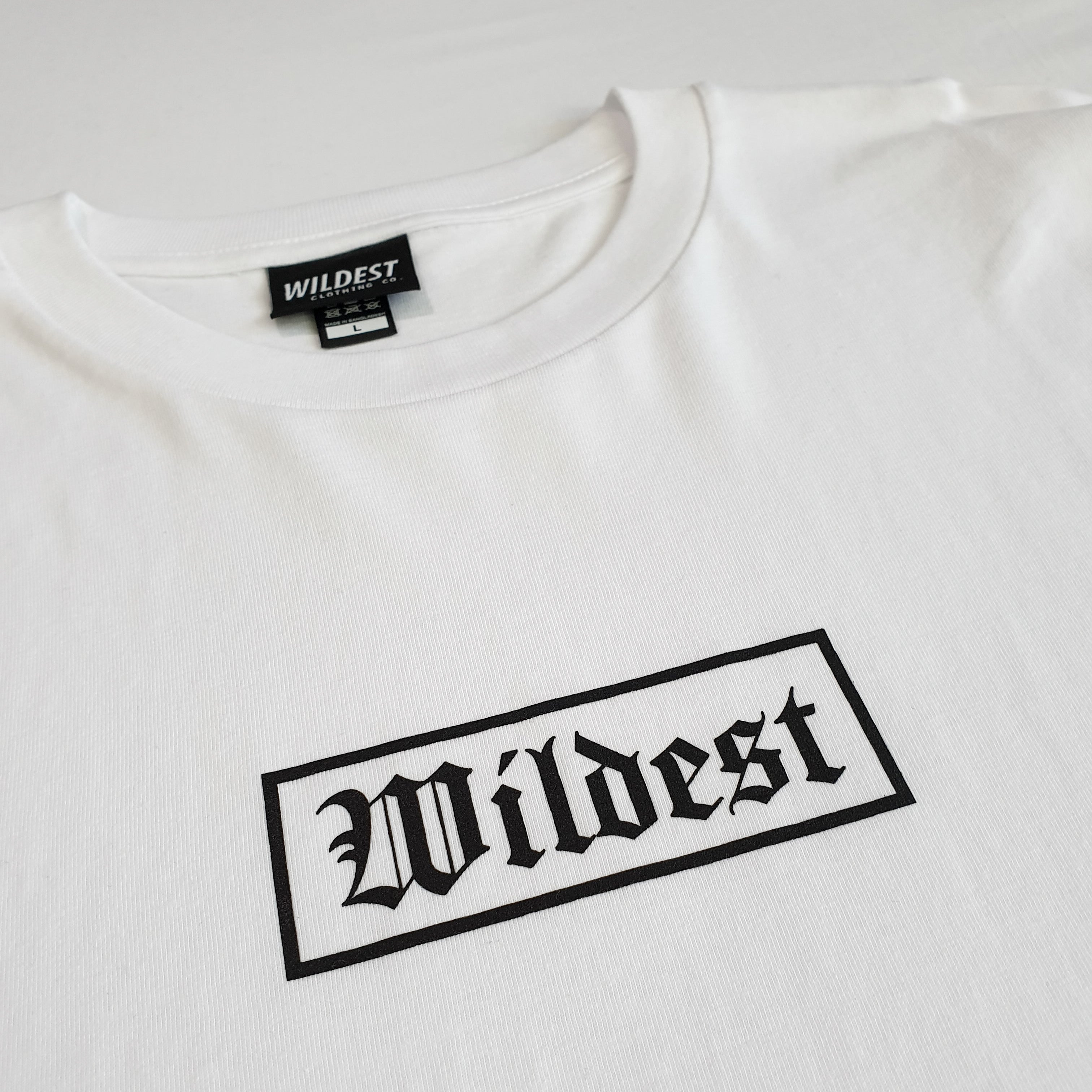 Close up of white long sleeve t shirt with black Wildest blackletter box print