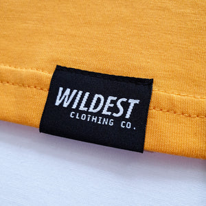 Close up of Wildest Clothing Co. brand tag on the bottom hem